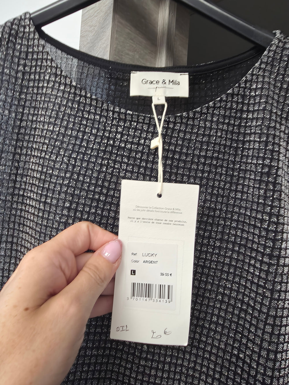 Blouse argentee neuve taille L