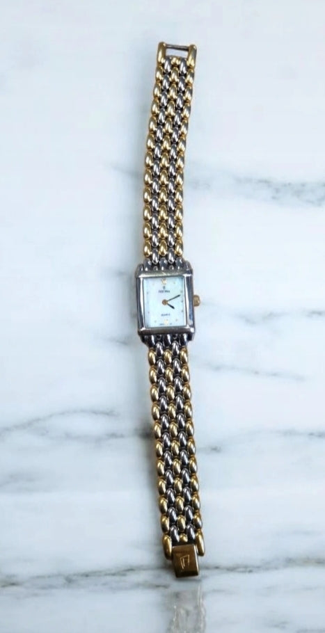 Montre festina doree et argentée